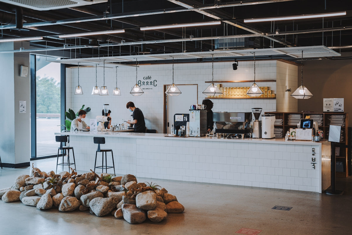 people standing in front of food counter