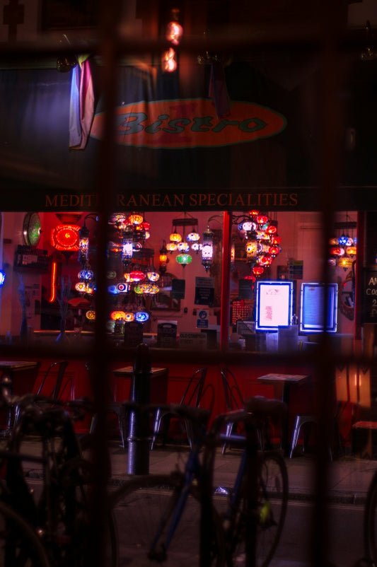 a restaurant with bikes parked outside of it