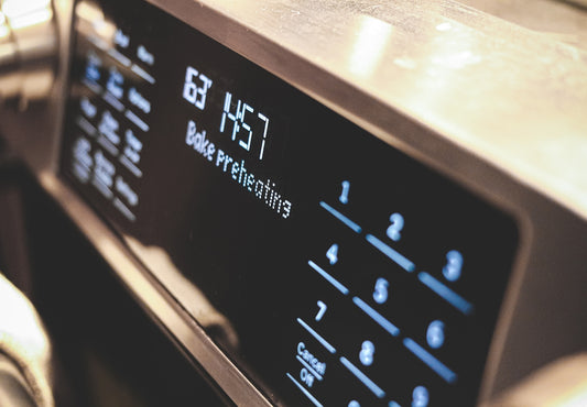 a close up of a microwave with buttons and numbers