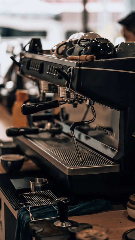a coffee machine sitting on top of a wooden table