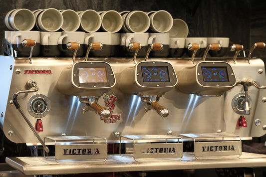 Professional espresso machine with three group heads.